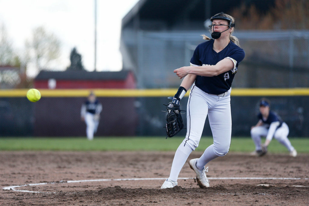 Arlington’s Lizzie Durfee delivers a pitch against Snohomish Tuesday, April 19, 2022, at Snohomish High School in Snohomish, Washington. (Ryan Berry / The Herald)
