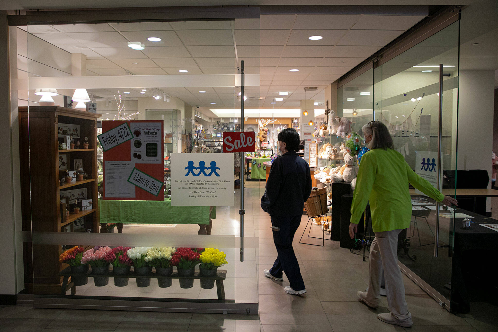 Two customers walk through the door at the Providence Regional Medical Center Everett gift shop. (Ryan Berry / The Herald)