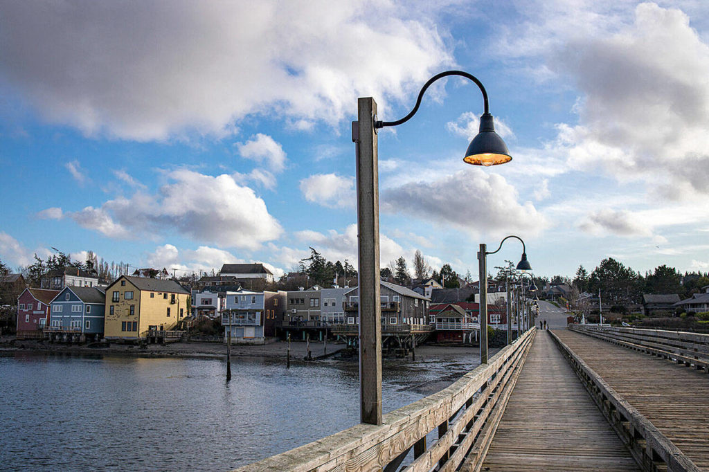 ”Coupeville Wharf & Cloudburst,” by Marianne Borozny, the featured artist for May at Penn Cove Gallery in Coupeville.
