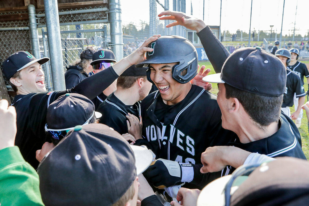 Jackson’s Dominic Hellman is celebrated for his three-run homer against Glacier Peak Friday afternoon at Glacier Peak High School in Snohomish, Washington on April 22, 2022. The Timberwolves won 12-4. (Kevin Clark / The Herald)