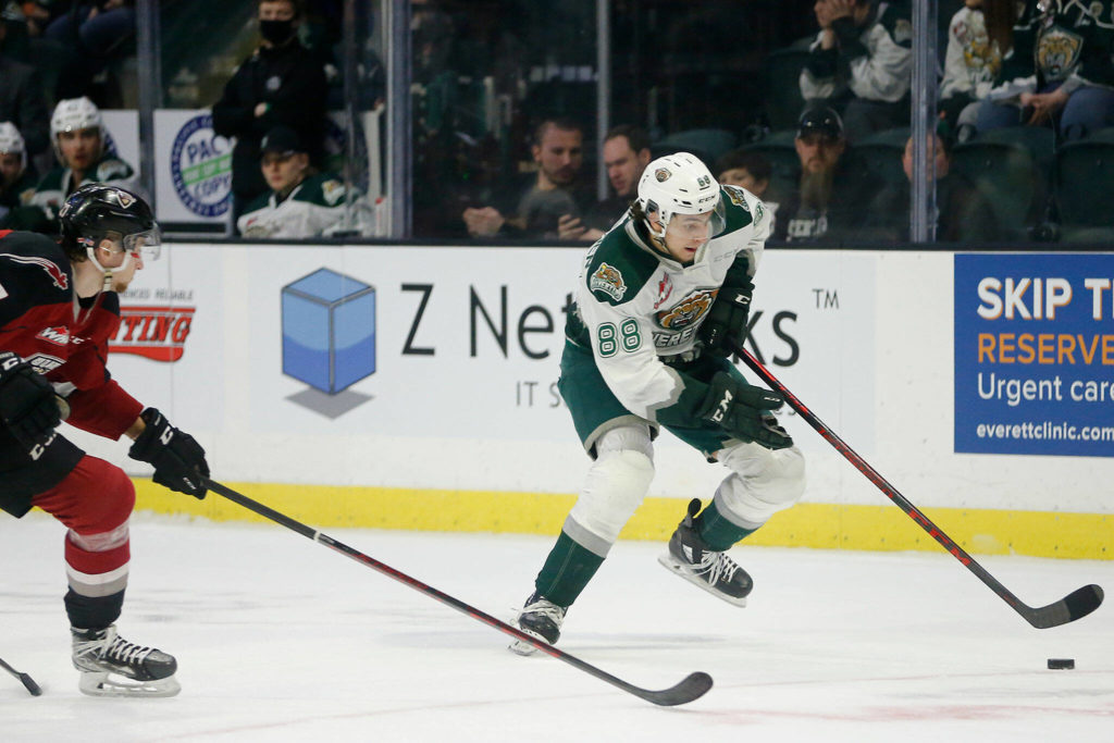 The Everett Silvertips’ Niko Huuhtanen tries to skate past the defense against the Vancouver Giants during the first round of the WHL playoffs Friday, April 22, 2022, at Angel of the Winds Arena in Everett, Washington. (Ryan Berry / The Herald)
