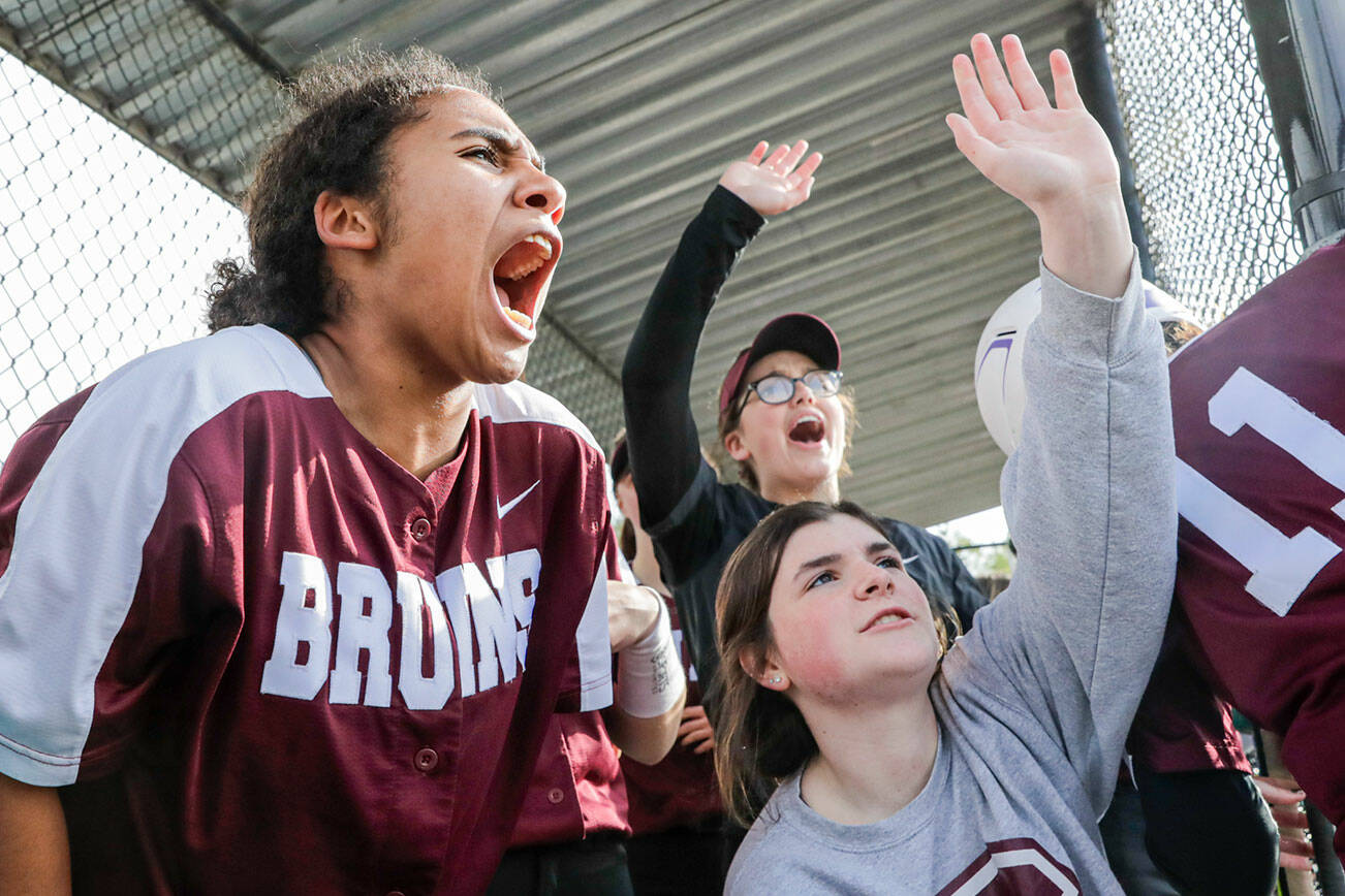 Members of Cascade team rally in the dug out against Shorewood Monday afternoon at Phil Johnson Ballfields in Everett, Washington on April 25, 2022. The Bruins won 6-2. (Kevin Clark / The Herald)