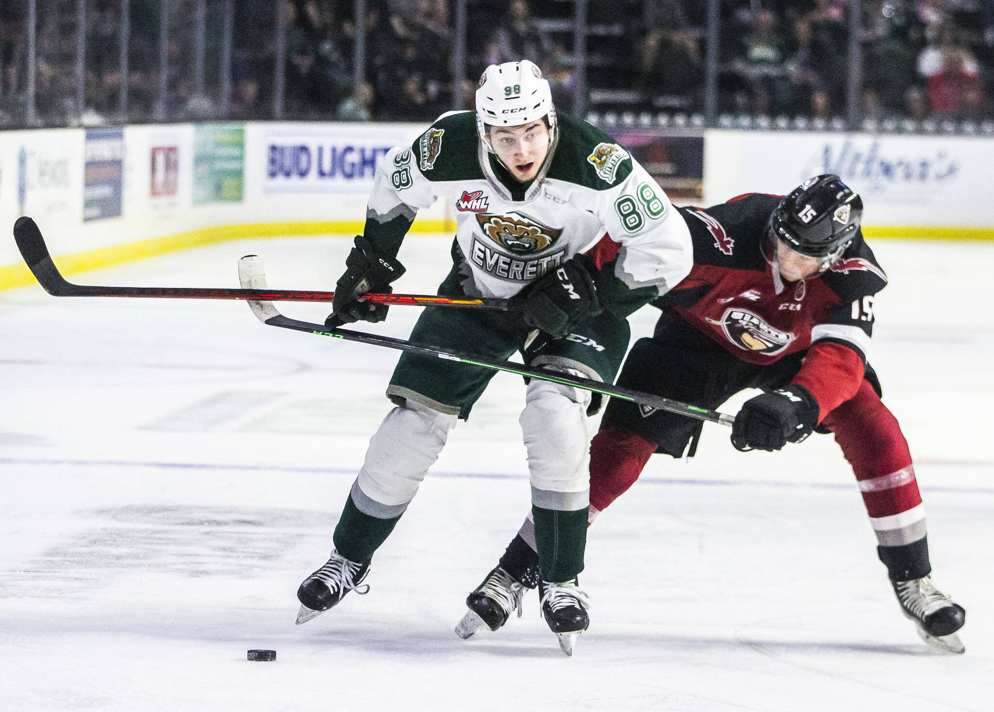 Everett Silvertips’ Niko Huuhtanen and Vancover Giants’ Jaden Lipinski fight for the puck during a playoff matchup Saturday in Everett. (Olivia Vanni / The Herald)