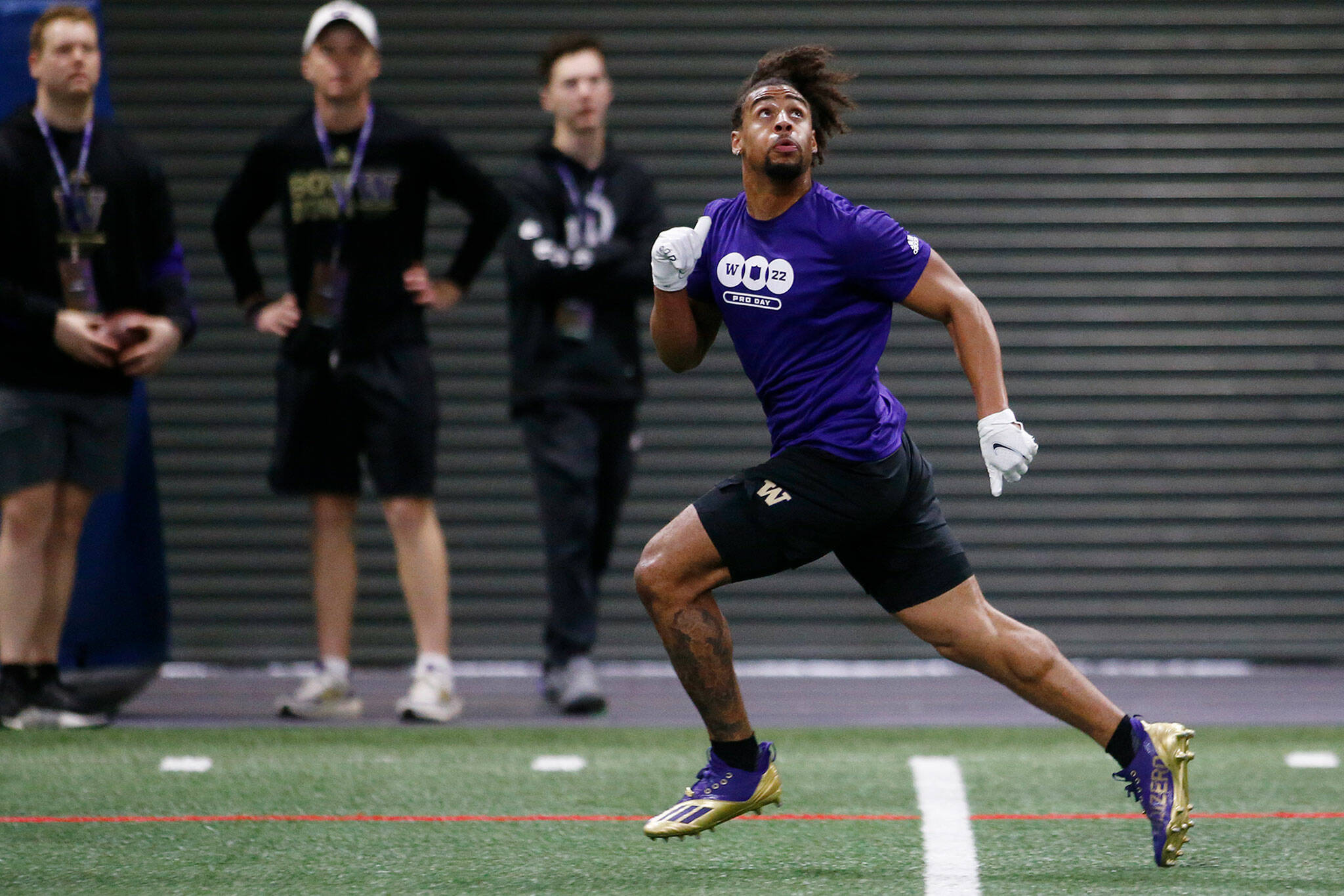Kyler Gordon, an Archbishop Murphy High School graduate and University of Washington cornerback, tracks the ball in the air during positional drills at UW’s Pro Day Tuesday, March 29, 2022, at the Dempsey Indoor Center in Seattle, Washington. (Ryan Berry / The Herald)