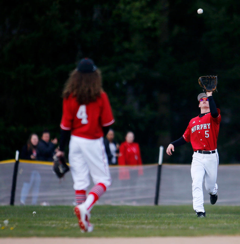 Archbishop Murphy’s Matt Overholt catch a fly ball to center field against Stanwood Thursday, April 28, 2022, at Archbishop Murphy High School in Everett, Washington. (Ryan Berry / The Herald)
