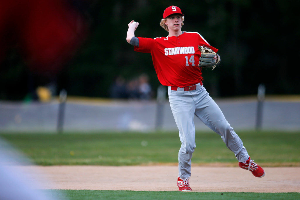 Stanwood’s Brandt Gilbertson makes a play at shortstop against Archbishop Murphy on Thursday at Archbishop Murphy High School in Everett. (Ryan Berry / The Herald)
