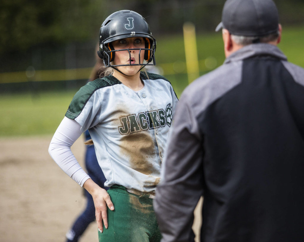 Jackson’s Avery Olson reacts to barely being safe at third base after running because of an overthrown ball to second base during the game against Glacier Peak on Thursday, April 28, 2022 in Everett, Washington. (Olivia Vanni / The Herald)
