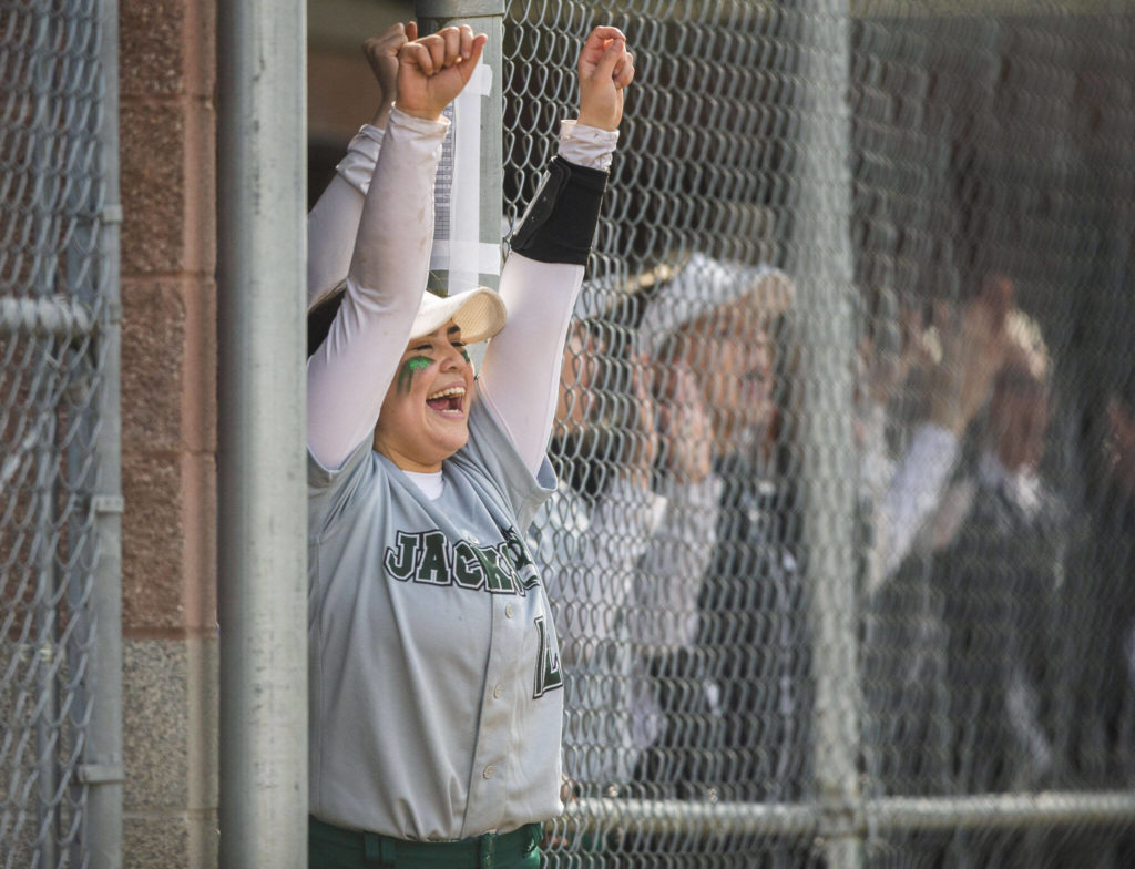 Jackson’s Kaila Zellmer cheers on her teammate during the game against Glacier Peak on Thursday, April 28, 2022 in Everett, Washington. (Olivia Vanni / The Herald)
