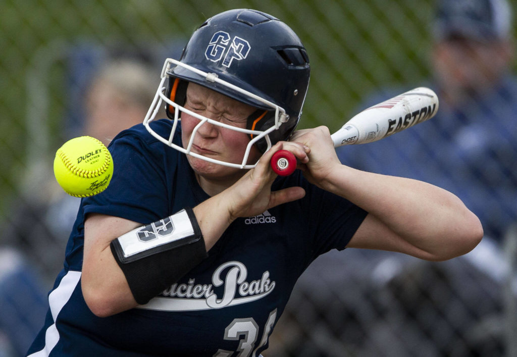 Glacier Peak’s Bree Titus grimaces after getting hit by a wild pitch during the game against Jackson on Thursday, April 28, 2022 in Everett, Washington. (Olivia Vanni / The Herald)
