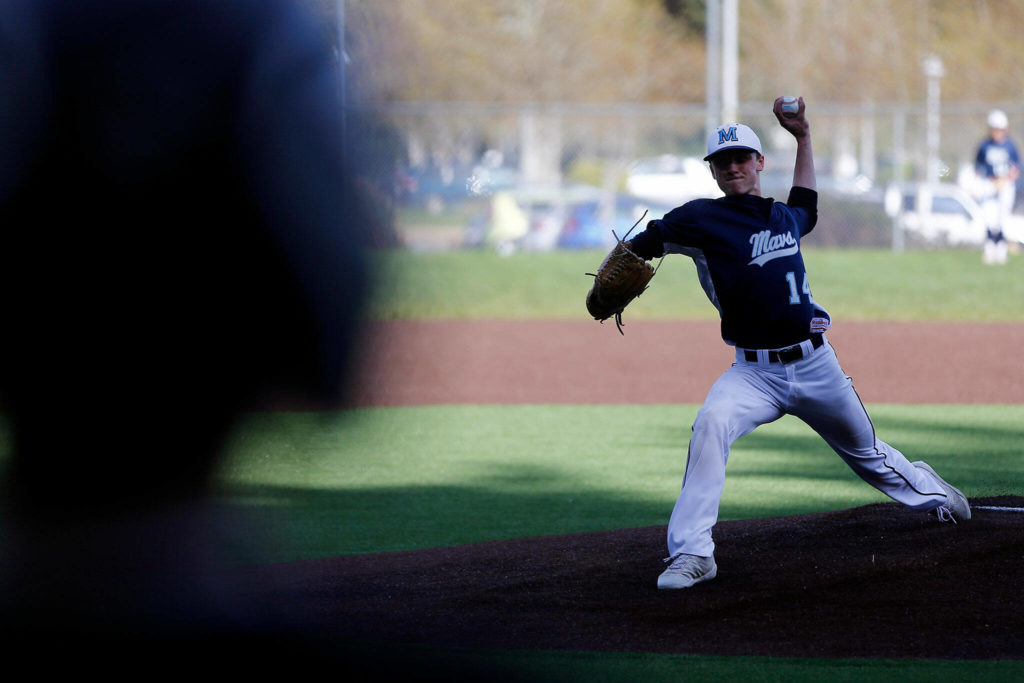 Meadowdale’s Broderick Bluhm delivers a pitch against Lynnwood Friday, April 29, 2022, at Meadowdale High School in Lynnwood, Washington. (Ryan Berry / The Herald)
