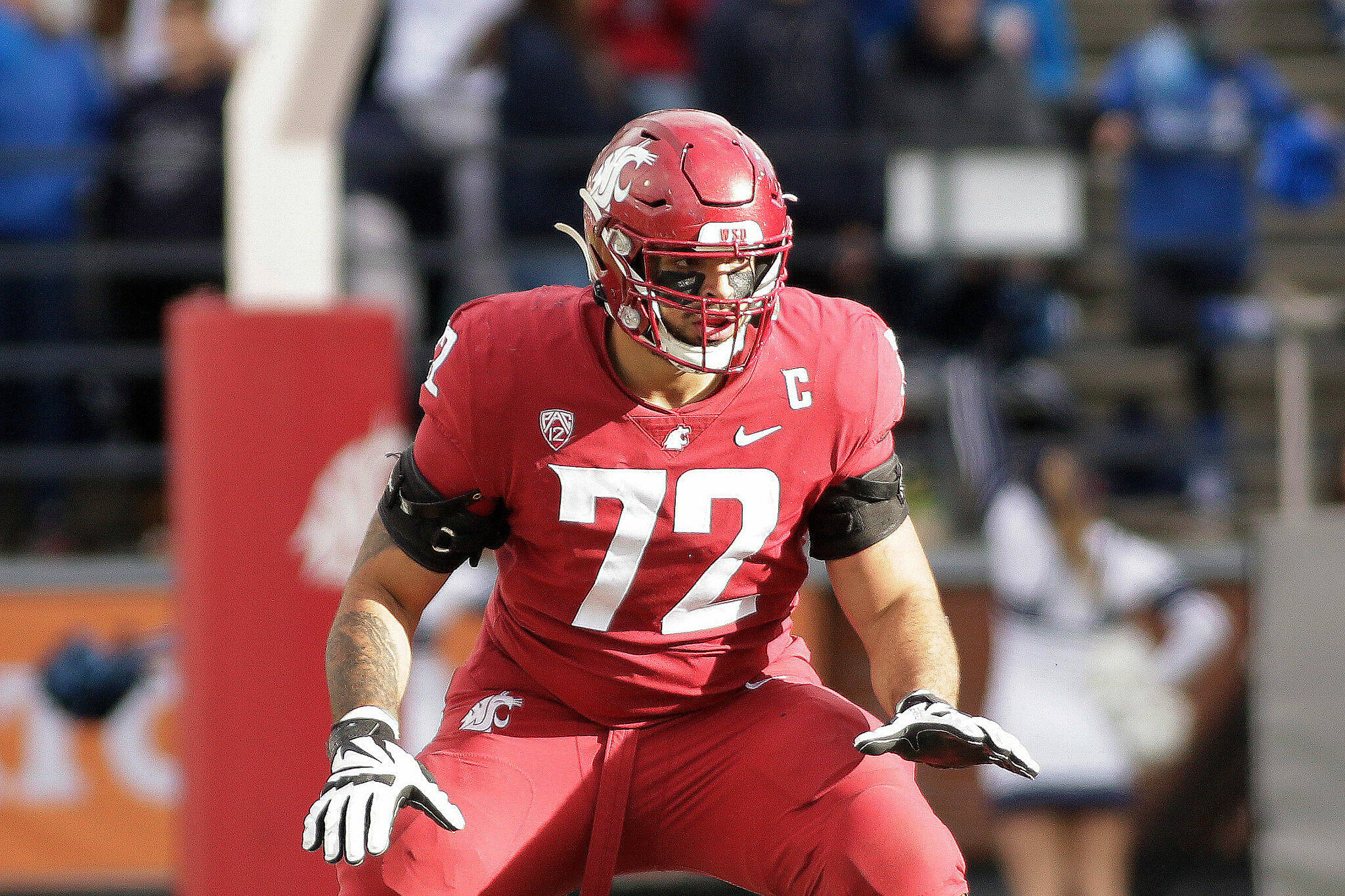 Washington State offensive tackle Abraham Lucas, an Archbishop Murphy alum, prepares to block during a game against BYU in 2021 in Pullman. (AP Photo/Young Kwak)