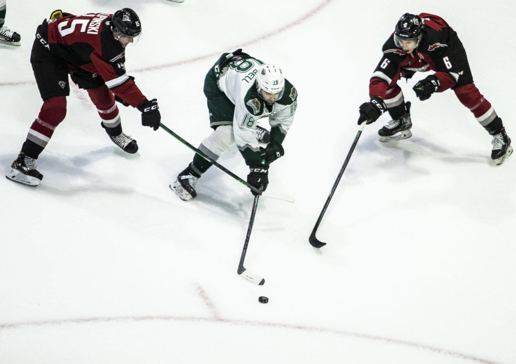 Silvertips’ Hunter Campbell is slashed by Giants’ Jaden Lipinski during the game against the Giants on Saturday, April 30, 2022 in Everett, Washington. (Olivia Vanni / The Herald)
