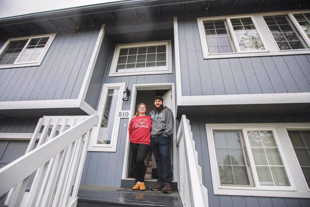 Sarah and Jared Ramey at their home in Sultan that they purchased in December. (Olivia Vanni / The Herald) 
