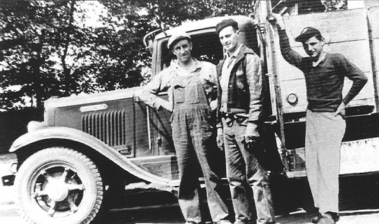 Fred Rubatino (left), an unidentified worker and Tom Rubatino in front of one of the company’s garbage trucks in 1944. (Rubatino Family)
