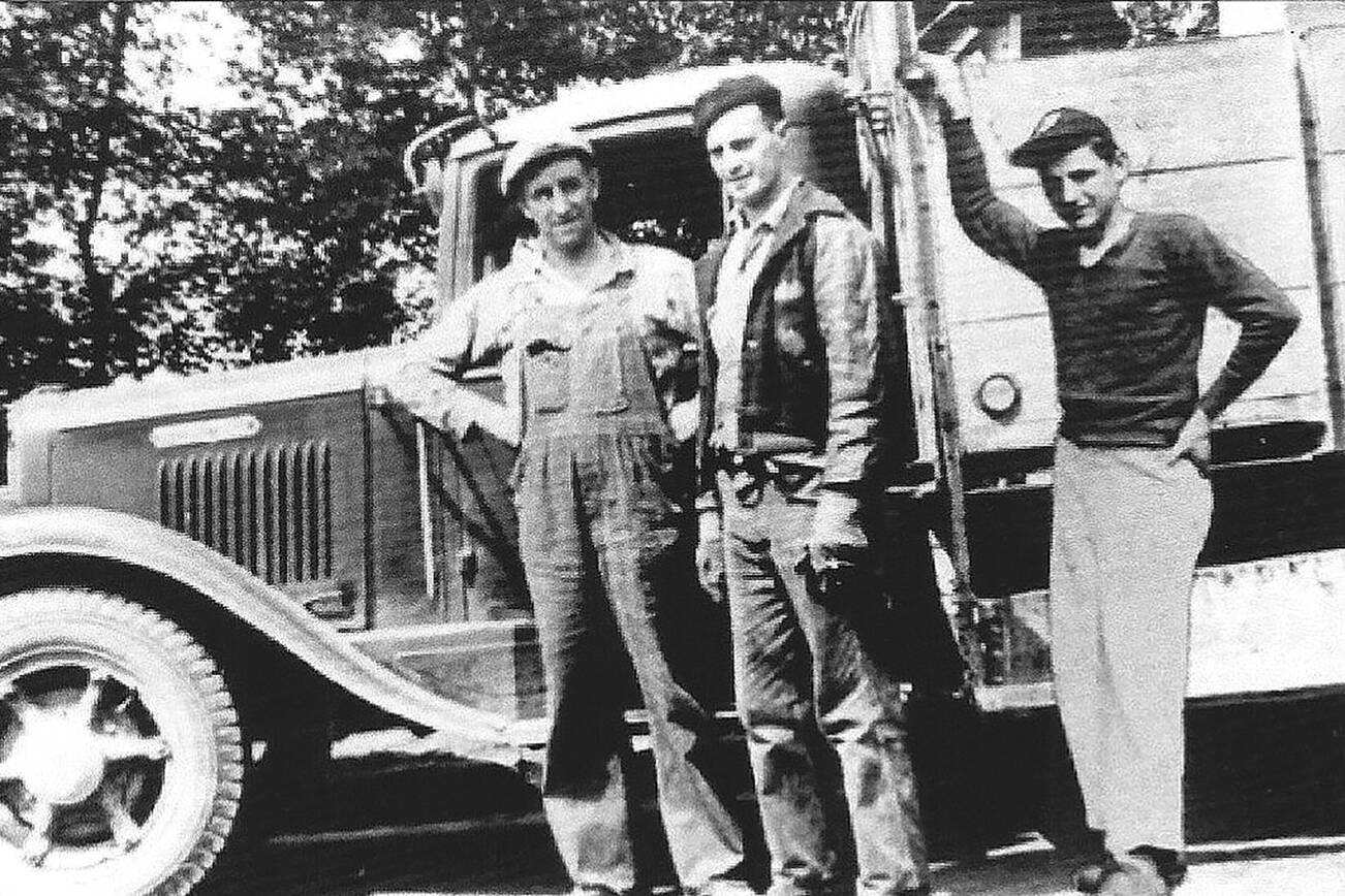 Fred Rubatino (left), an unidentified worker and Tom Rubatino in front of one of the company's garbage trucks in 1944.  (Rubatino Family)