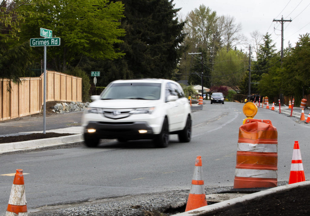 Traffic moves along Filbert Drive next to a new section of the North Creek Regional Trail. (Olivia Vanni / The Herald)
