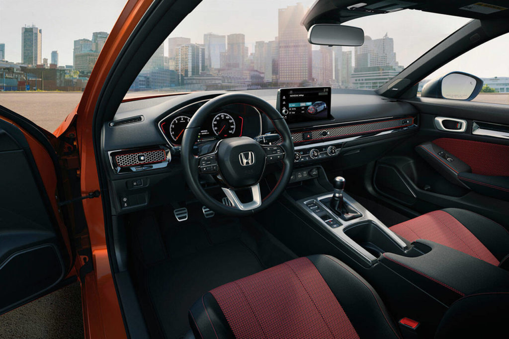 Driver and front passenger sport seats with red inserts are exclusive to the Si version of the 2022 Honda Civic compact sedan. (Manufacturer photo)
