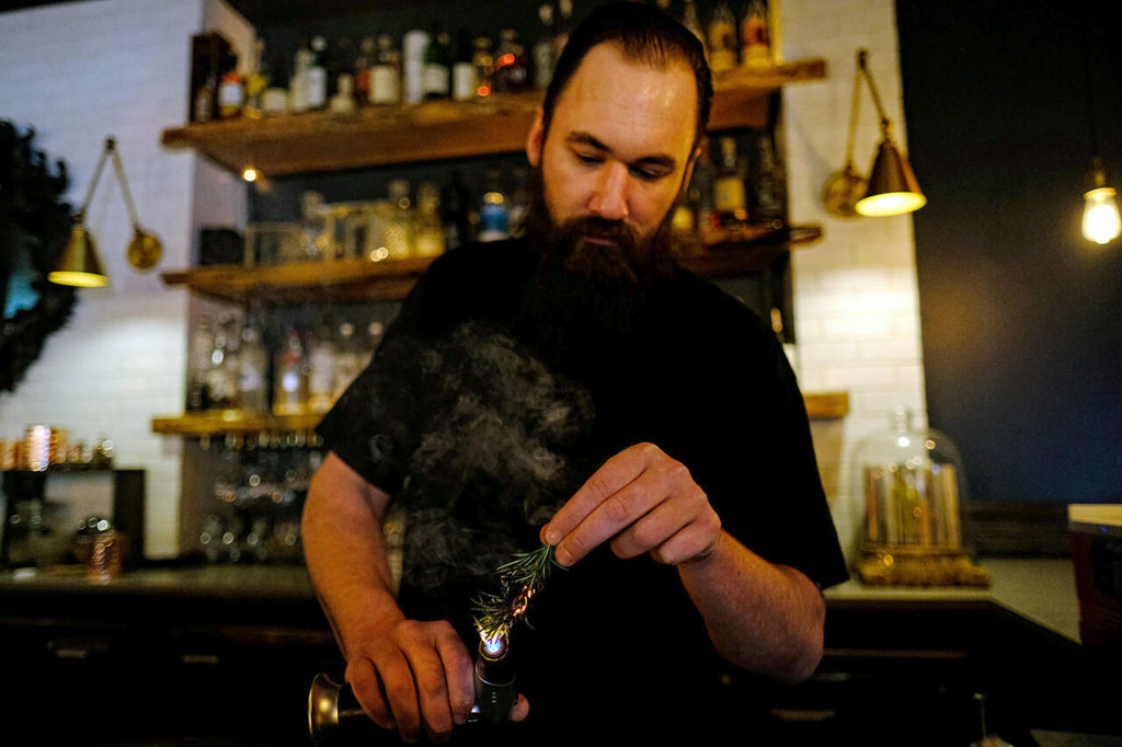 Andrew Greulich manages the bar at LJ’s Bistro. Co-owner Lindsay Herschlip is the head chef. (Taylor Goebel / The Herald)
