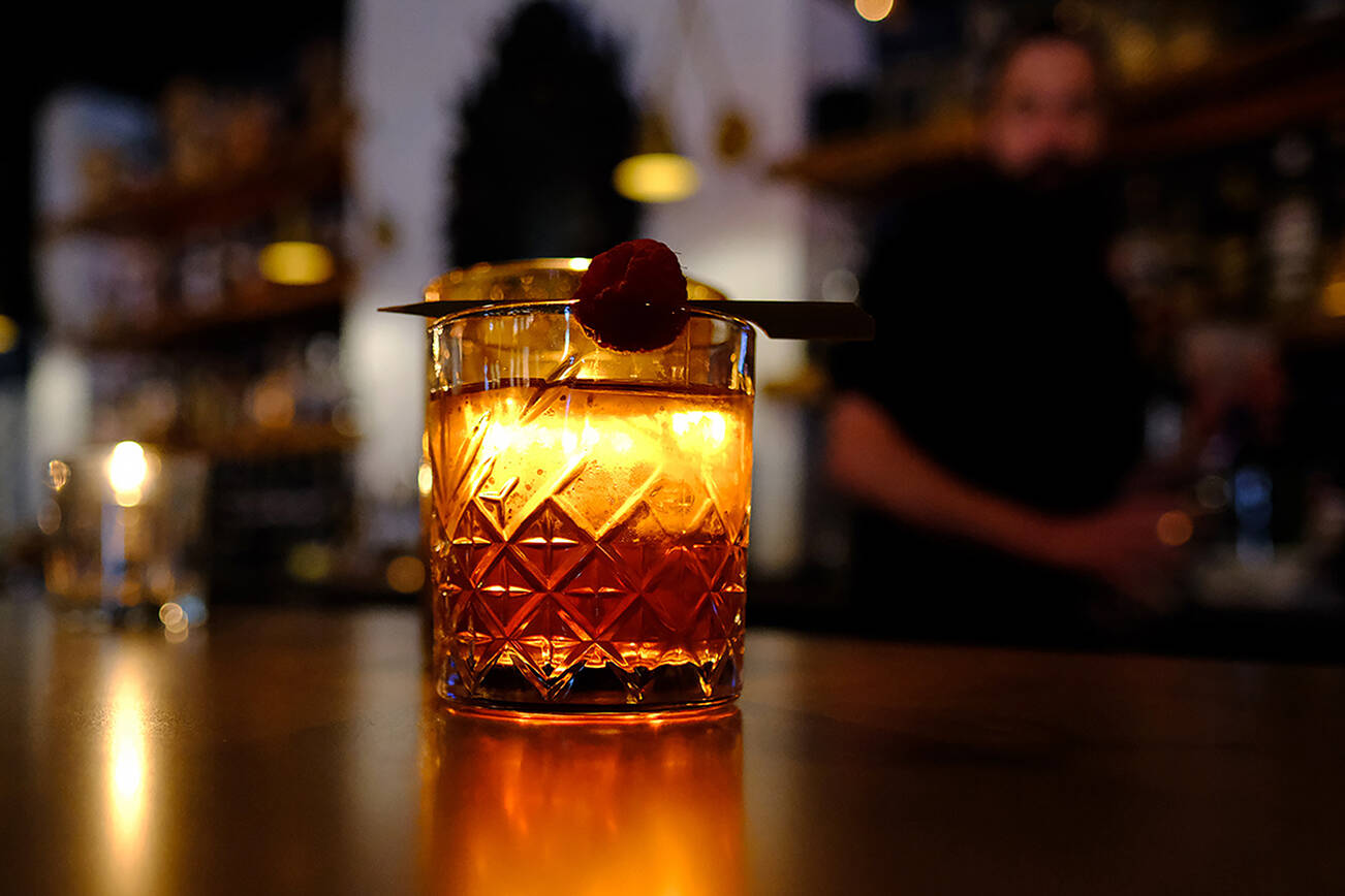 The Razzle-Dazzle Milk Punch ($14) at LJ's Bistro in Lake Stevens, with elderberry gin, raspberry, Pimm's and green tea. Friday, April 29, 2022. (Taylor Goebel / The Herald)