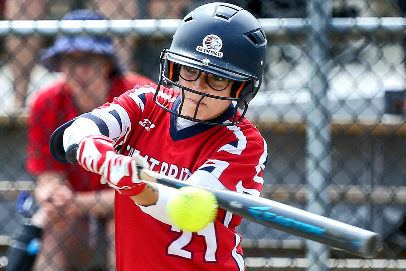 Aubrey Peterson makes a base hit during the Canada Cup Thursday morning in Surrey British Columbia on July 11, 2019.  Kevin Clark / The Herald)