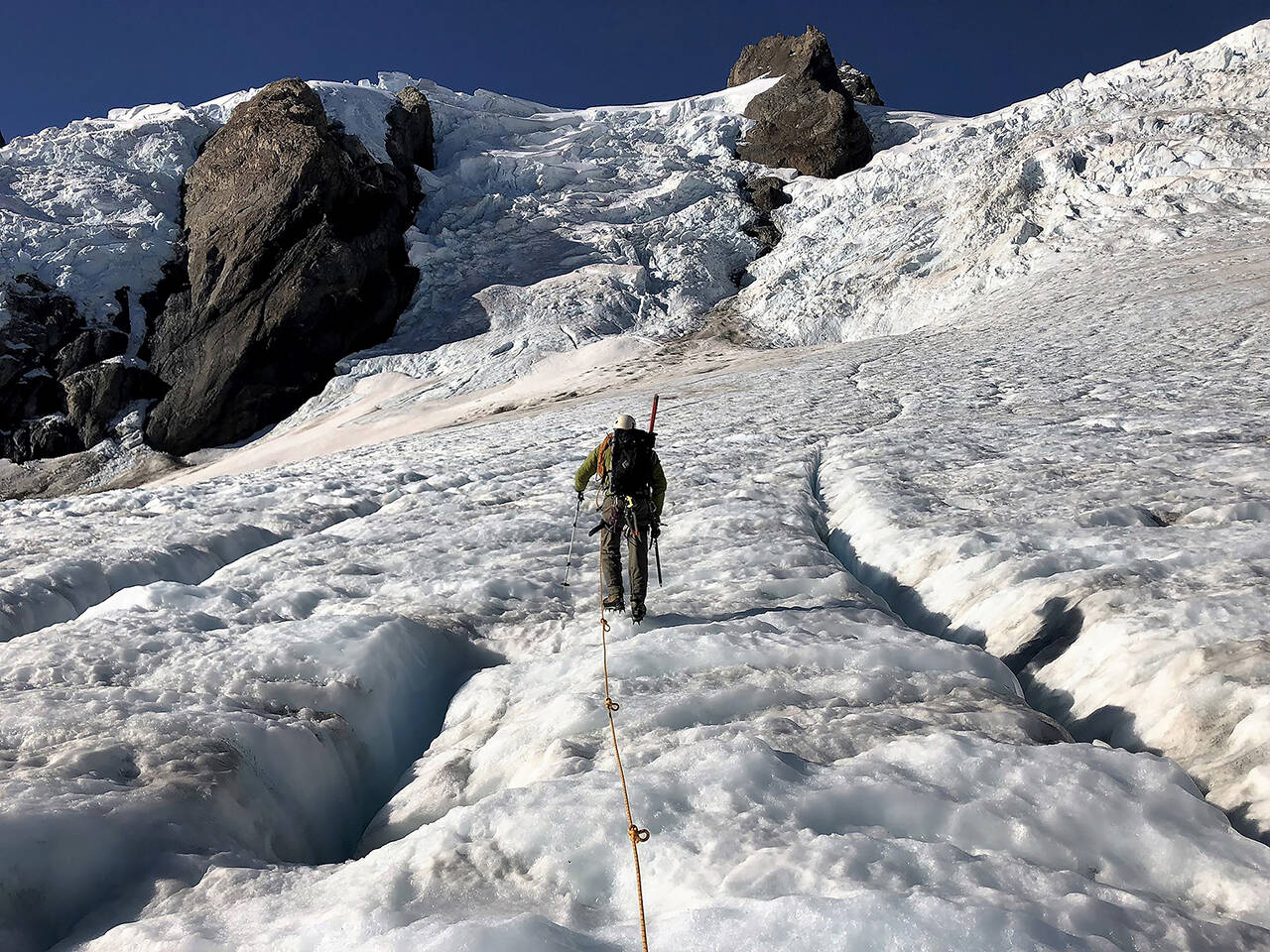 Park scientists take measurements on the Olympic Peninsula’s Blue and Eel Glaciers in 2018. (Olympic National Park)