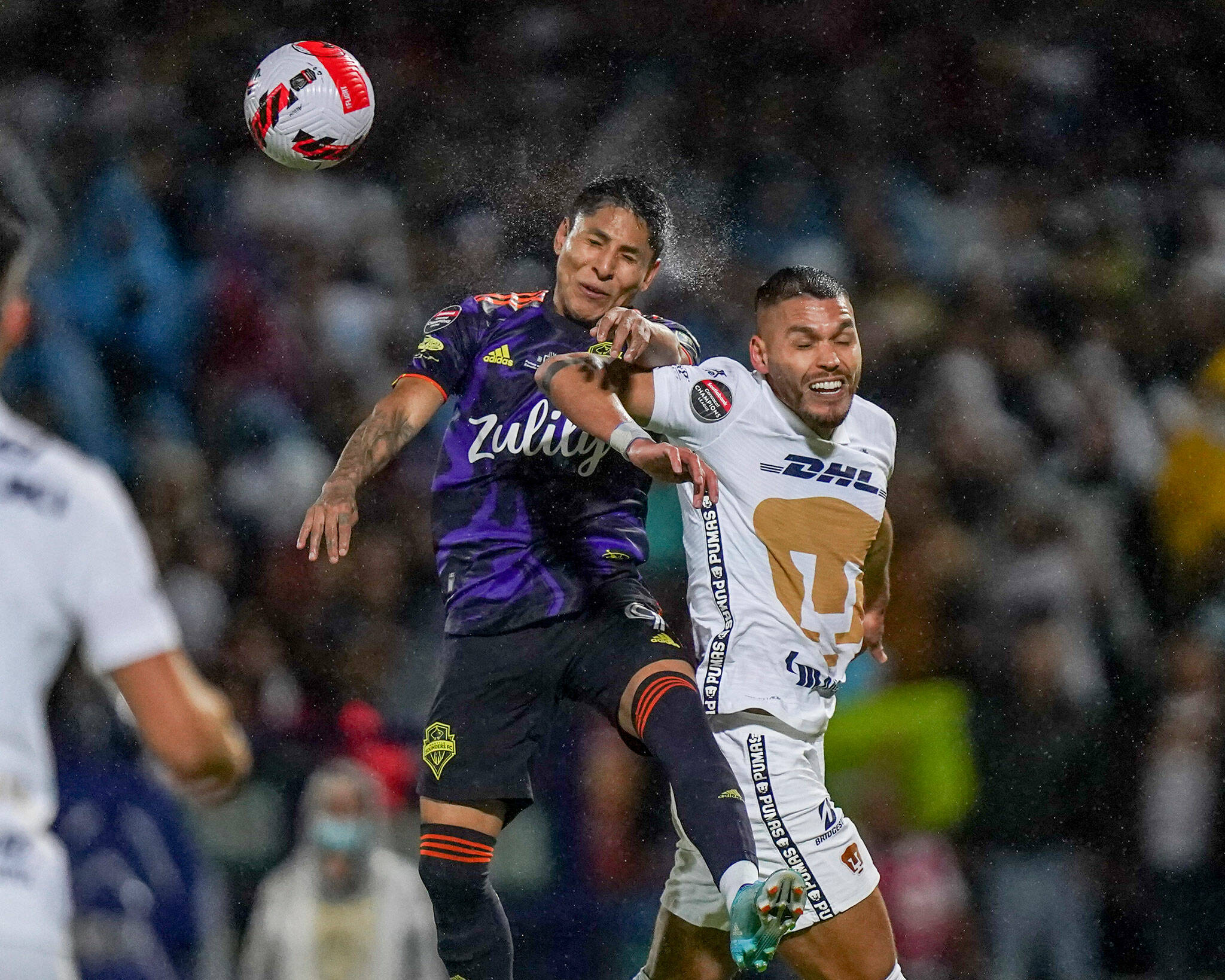 Nicolas Freire of Mexico’s Pumas (right) and Raul Ruidíaz of United States’ Seattle Sounders fight for the ball during the first leg of the CONCACAF Champions League final on April 27 in Mexico City. (AP Photo/Marco Ugarte)