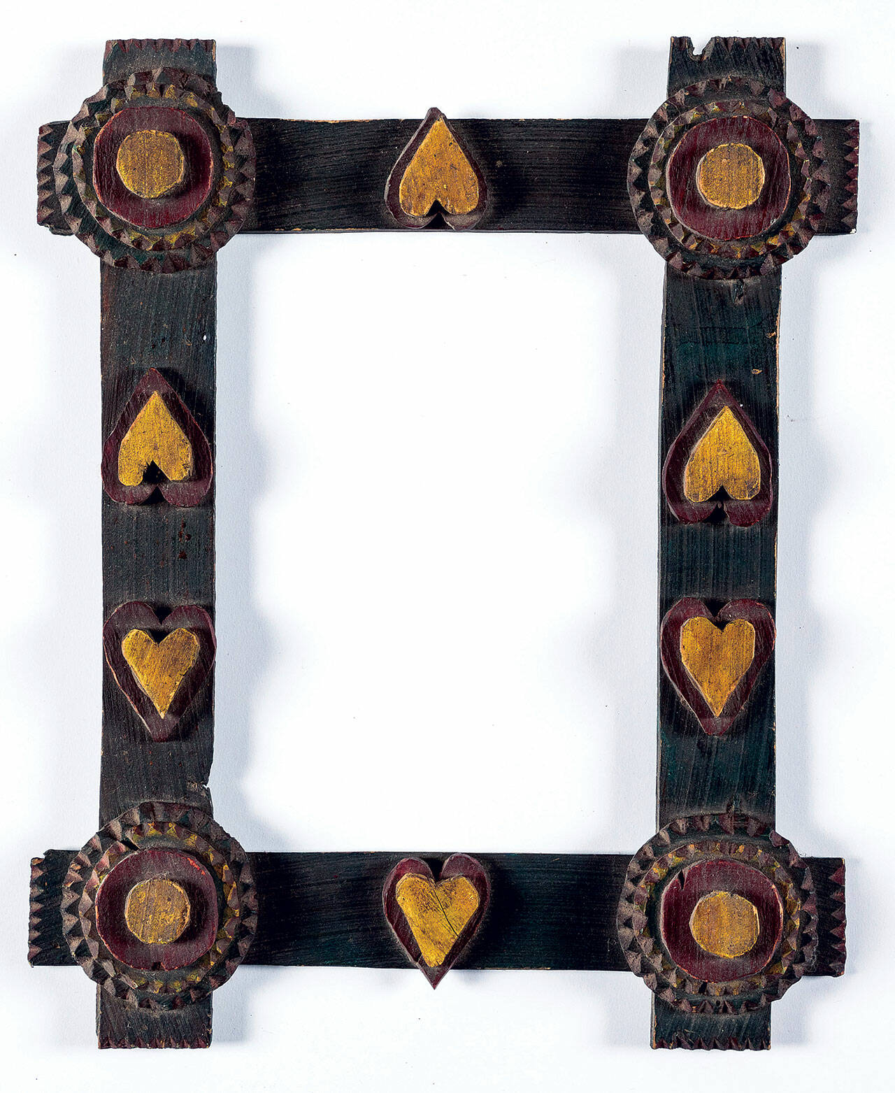 This tramp art picture frame was carved and painted by hand. It sold for $315 at a Pook & Pook auction.