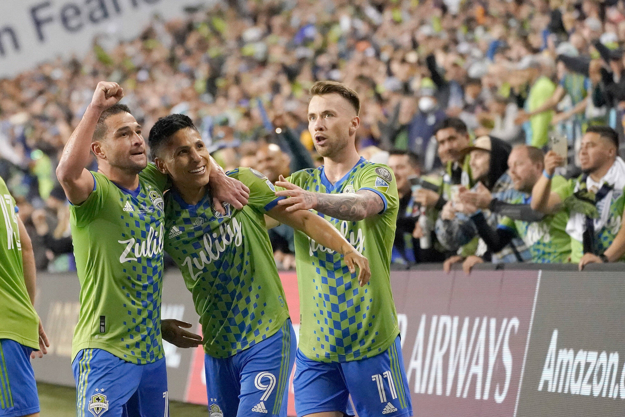 Sounders forward Raul Ruidiaz (9) celebrates his goal with teammates during the second half of the second leg of the CONCACAF Champions League final against Mexico’s Pumas on Wednesday in Seattle. (AP Photo/Ted S. Warren)