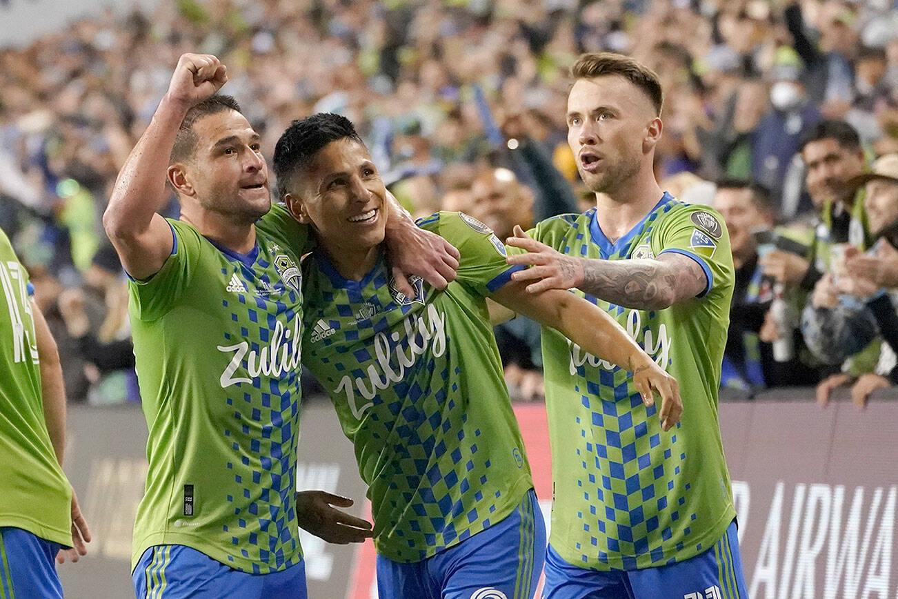 United States' Seattle Sounders forward Raul Ruidiaz (9) celebrates his goal with teammates during the second half of the second leg of the CONCACAF Champions League soccer final against Mexico's Pumas, Wednesday, May 4, 2022, in Seattle. (AP Photo/Ted S. Warren)