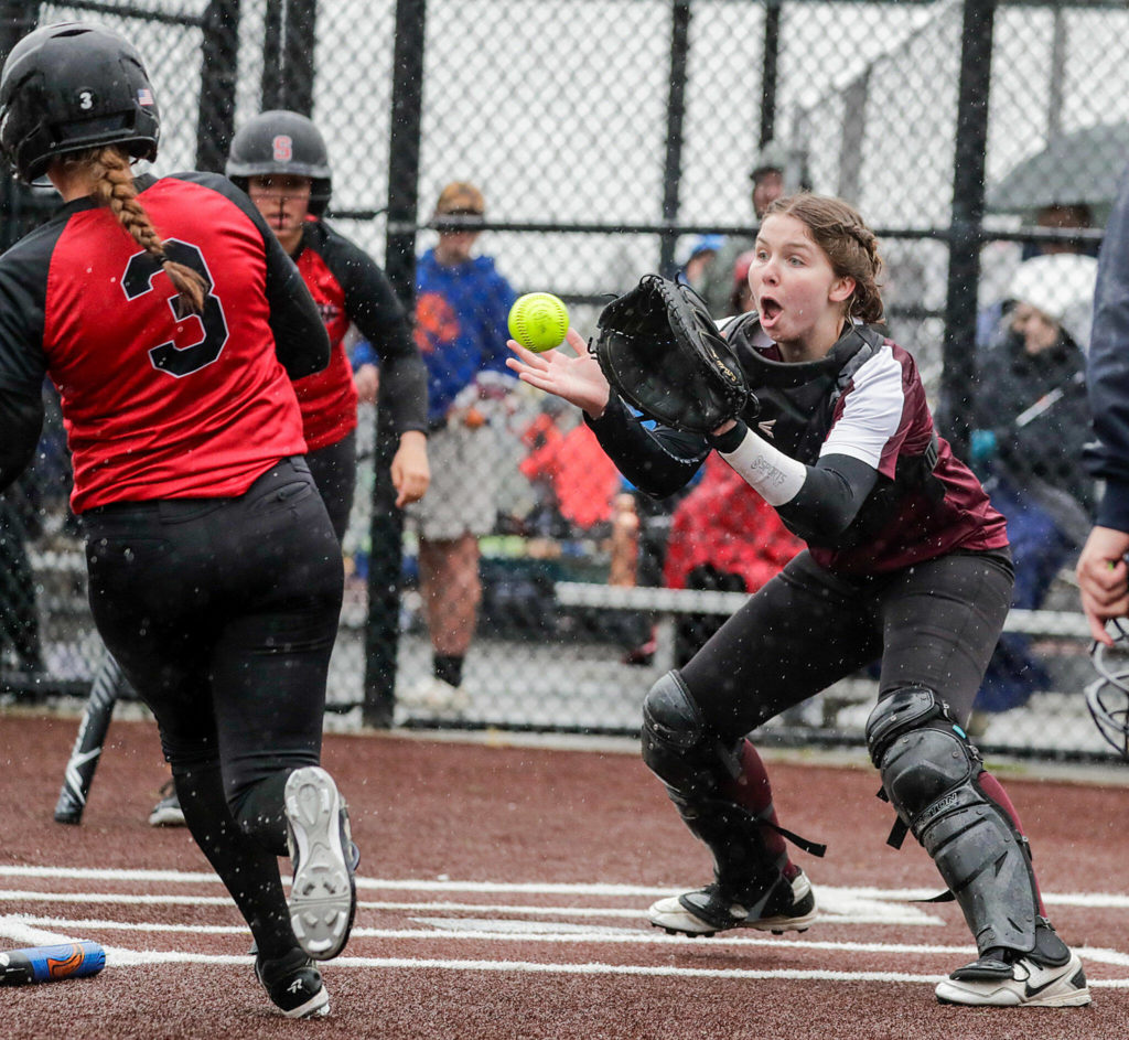 Cascade’s Katelyn Pryor catches the throw to tag out Snohomish’s Kendel Sage Thursday afternoon at Phil Johnson Ballfields in Everett, Washington on May 5, 2022. The Panthers won 9-3 in a key matchup between two of the top teams in Wesco 3A/2A. (Kevin Clark / The Herald)

