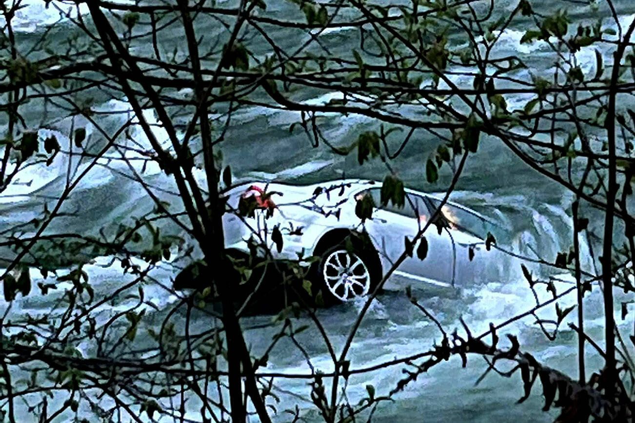 A car became partially submerged after entering the Sauk River near Backman County Park off of Clear Creek Road on May 6, 2022. (Darrington Fire District)