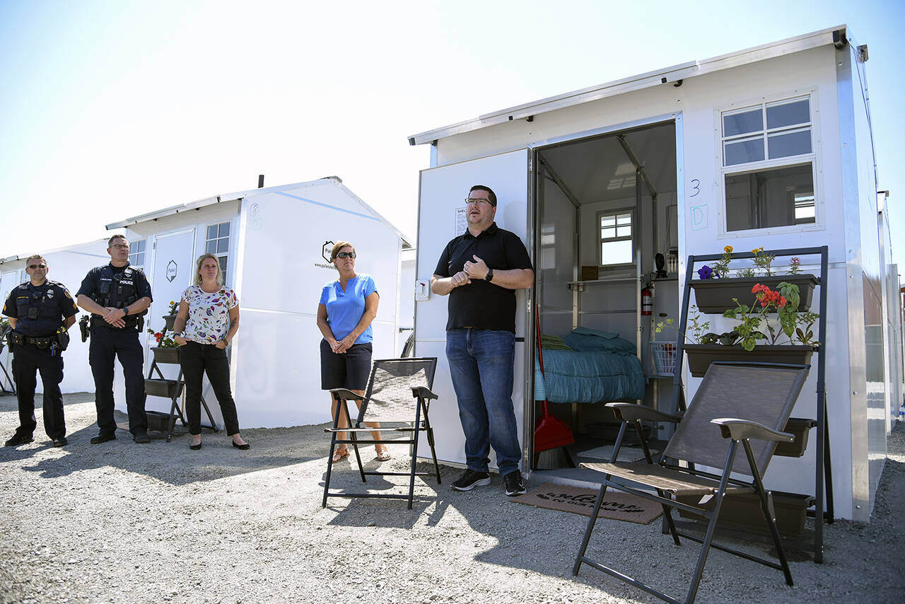 Patrick Diller, head of community partnerships for Pallet, the Everett-based company that makes Pallet shelters, discusses the Pallet Shelter pilot project in June 2021 in Everett. (Katie Hayes / Herald file)