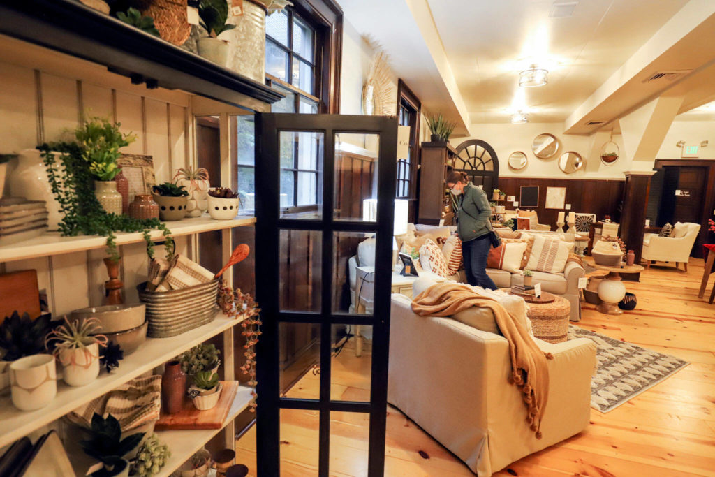 Marni Swart browses though the Lamb & Co. home decor store Jan. 8 in Snohomish. (Kevin Clark / Herald file)
