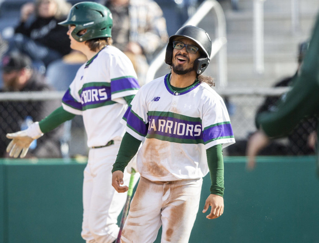 Edmonds-Woodway’s Nathnuel Marinez reacts to scoring a run during the district semifinal game at Funko Field on Tuesday in Everett. (Olivia Vanni / The Herald)
