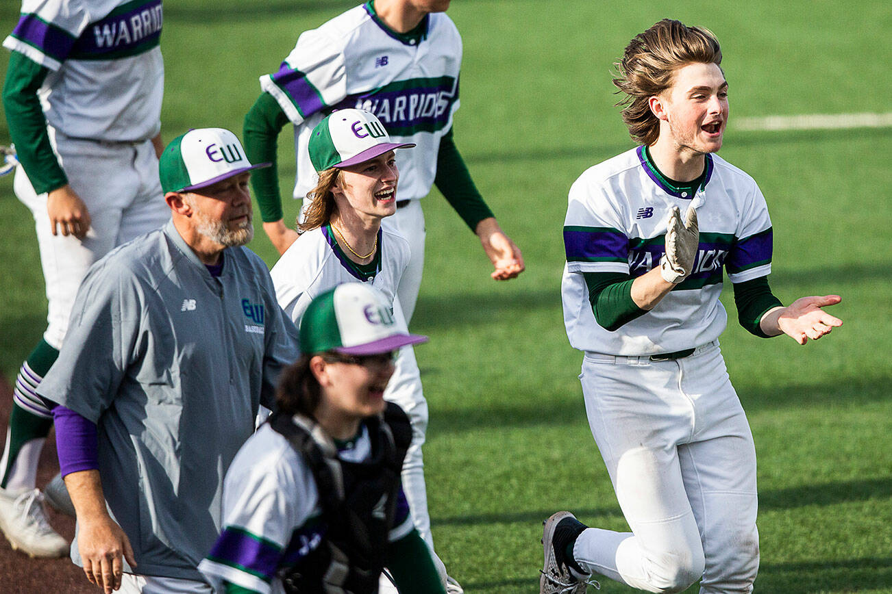 Edmonds-Woodway players react to winning the district semifinal game against Mountlake Terrace to advance to state at Funko Field on Tuesday, May 10, 2022 in Everett, Washington. (Olivia Vanni / The Herald)