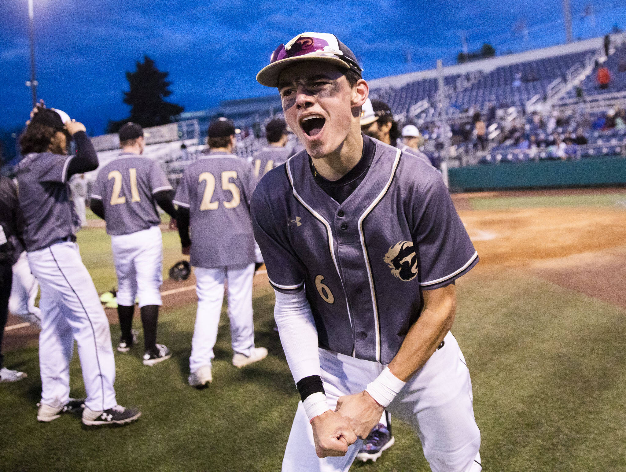 Lynnwood sophomore Jace Hampson yells in celebration after the Royals clinched a state berth with a 3-2 win over Meadowdale in a Class 3A District 1 Tournament semifinal Tuesday night at Funko Field. (Olivia Vanni / The Herald)