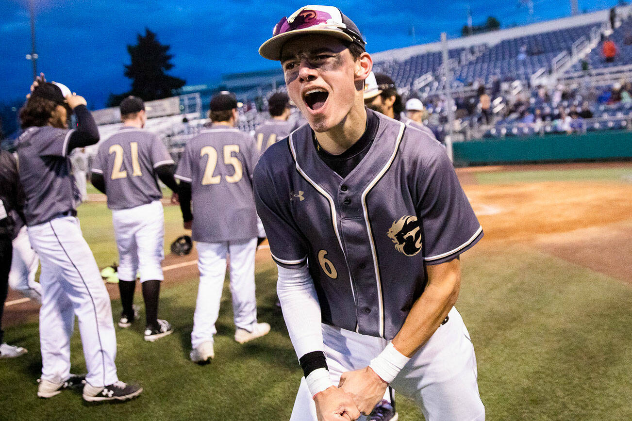 Lynnwood’s Jace Hampson yells in celebration after winning the district semifinal game against Meadowdale to send them to state at Funko Field on Tuesday, May 10, 2022 in Everett, Washington. (Olivia Vanni / The Herald)