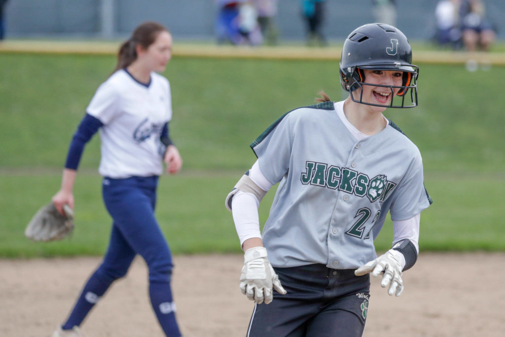 Jackson freshman Allie Thomsen rounds third base after hitting a game-tying two-run homer. (Kevin Clark / The Herald)
