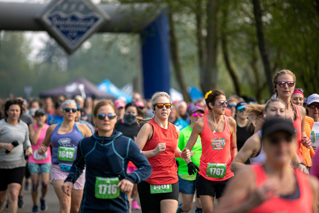 Hundreds of runners take off at the beginning of the 9th annual Snohomish Women’s Run on May 1 at Rotary Park in Everett. (Ryan Berry / The Herald)
