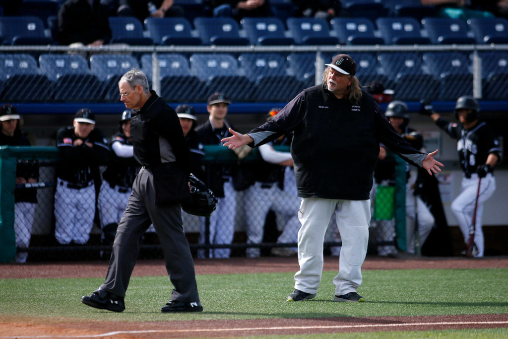 Jackson head coach Kirk Nicholson argues with the umpire during a game against Bothell Friday, May 13, 2022, at Funko Field in Everett, Washington. (Ryan Berry / The Herald)
