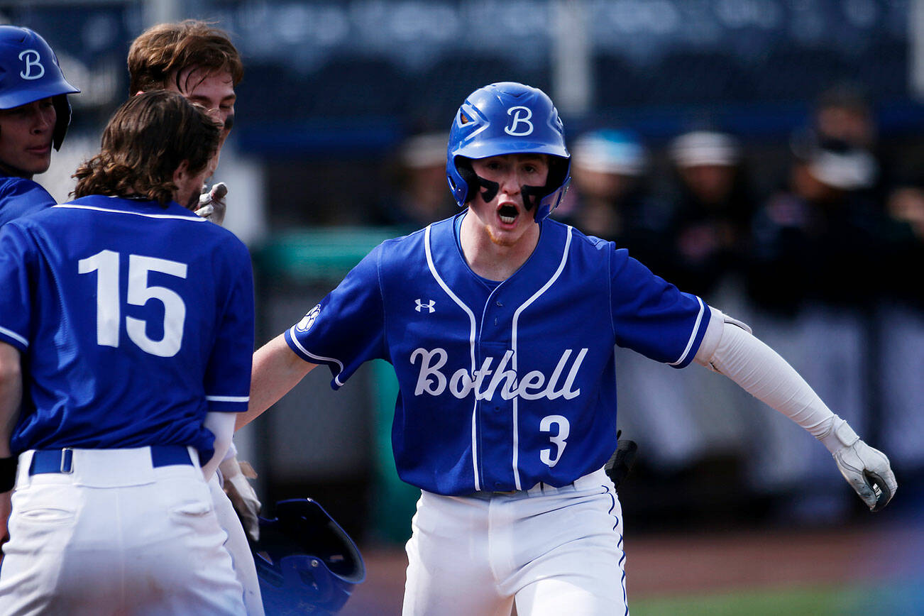Bothell’s Maxwell Paterson celebrates a deep home run to put his team in the lead against Jackson Friday, May 13, 2022, at Funko Field in Everett, Washington. (Ryan Berry / The Herald)