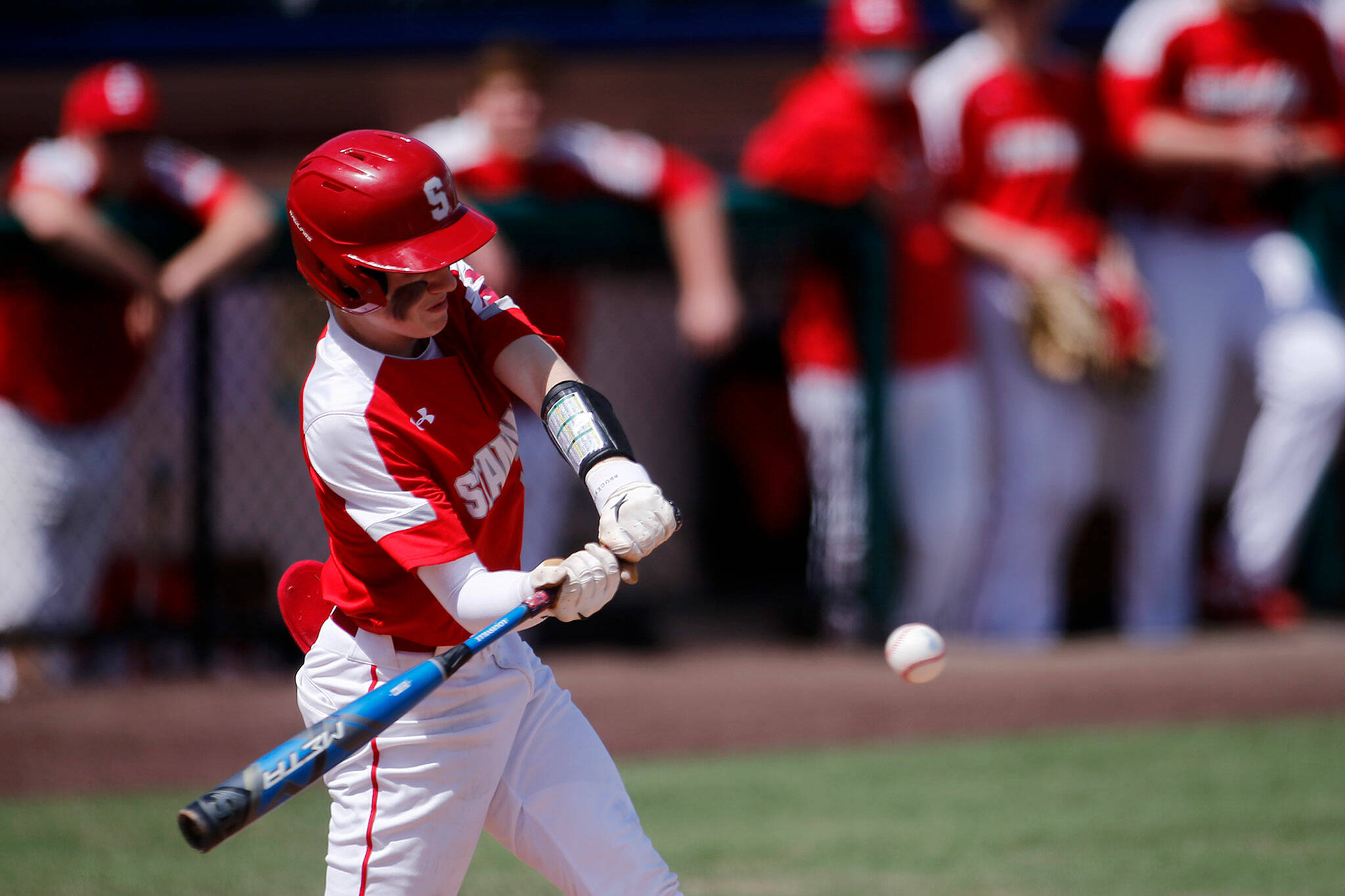 Stanwood’s Tryston Stephenson takes a swing against Meadowdale Saturday, May 14, 2022, during a 3A district matchup at Funko Field in Everett, Washington. (Ryan Berry / The Herald)