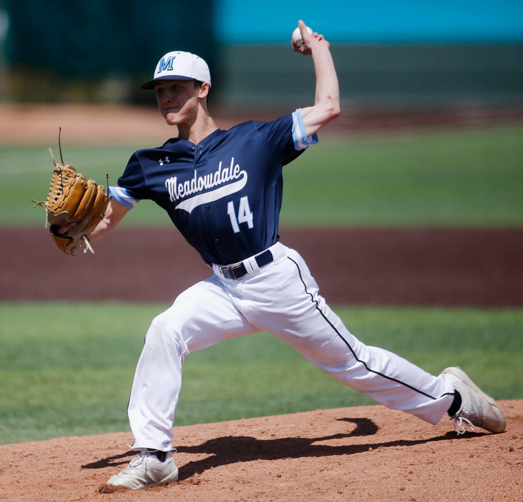 Meadowdale’s Broderick Bluhm delivers a pitch against Stanwood Saturday, May 14, 2022, during a 3A district matchup at Funko Field in Everett, Washington. (Ryan Berry / The Herald)
