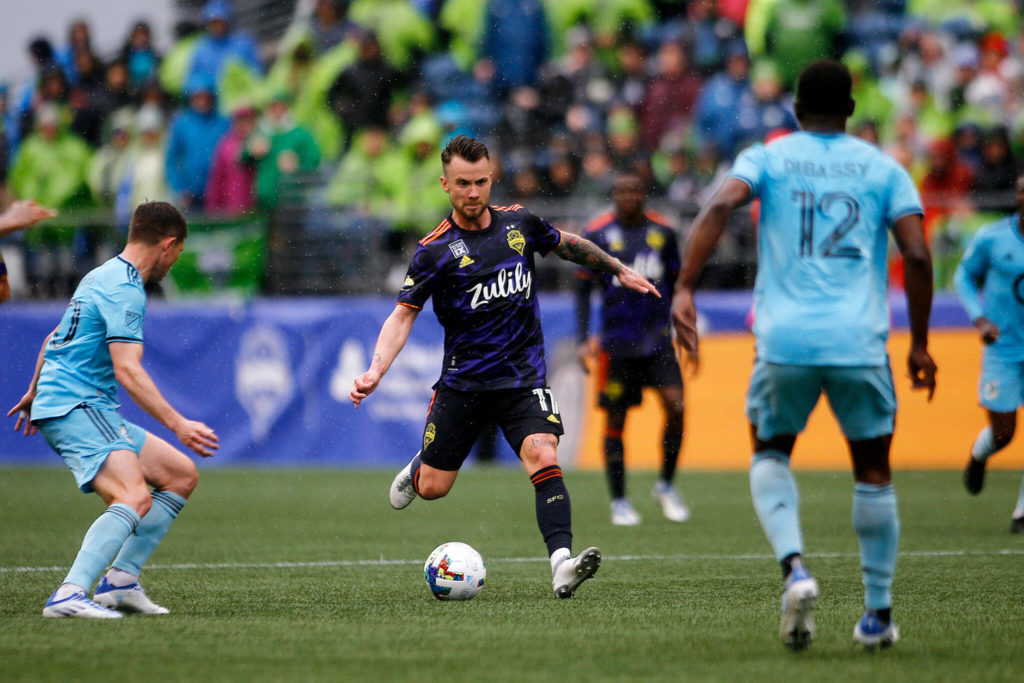 Seattle Sounders’ Albert Rusnák sends the ball up to a teammate against Minnesota United Sunday at Lumen Field in Seattle. (Ryan Berry / The Herald)
