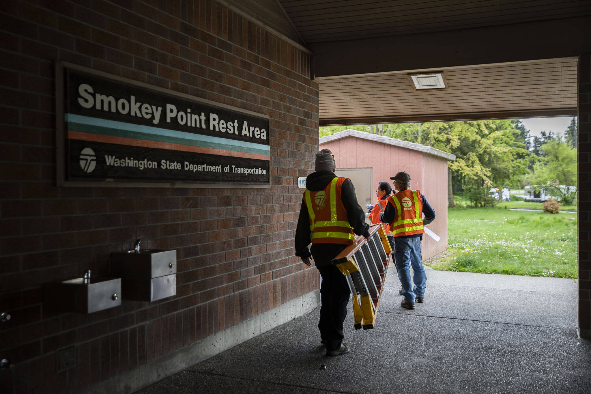 WSDOT workers open up the Smokey Point Rest Area on Tuesday in Arlington. (Olivia Vanni / The Herald)