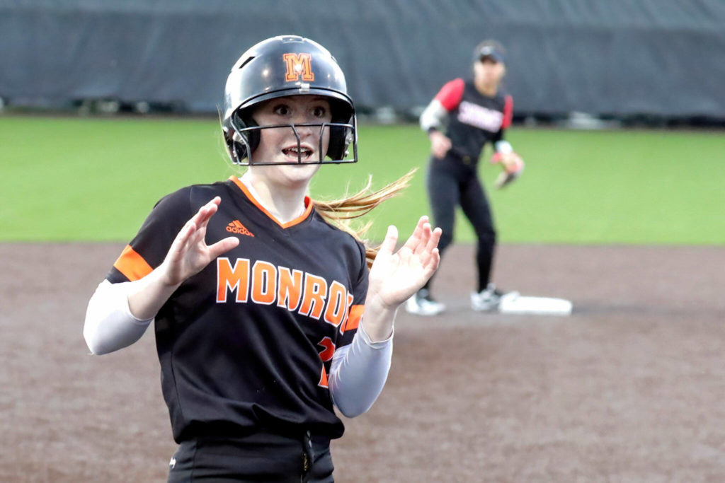 Monroe freshman Hadley Oylear is safe at third base. (Kevin Clark / The Herald)
