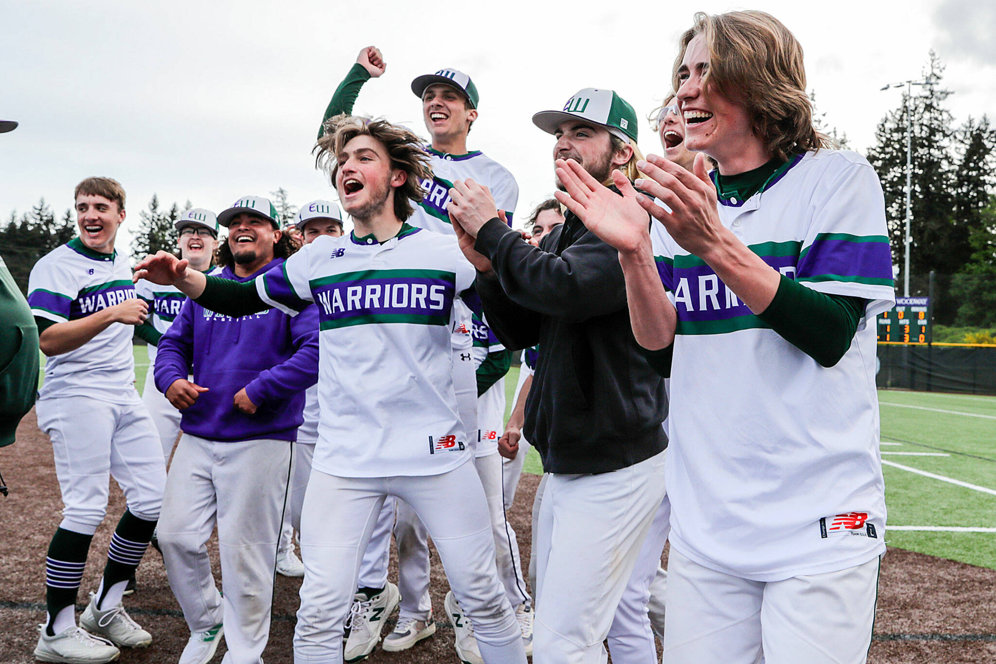 Edmonds-Woodway players celebrate their 2-1 eighth-inning walkoff win over Gig Harbor on Tuesday. (Kevin Clark / The Herald)