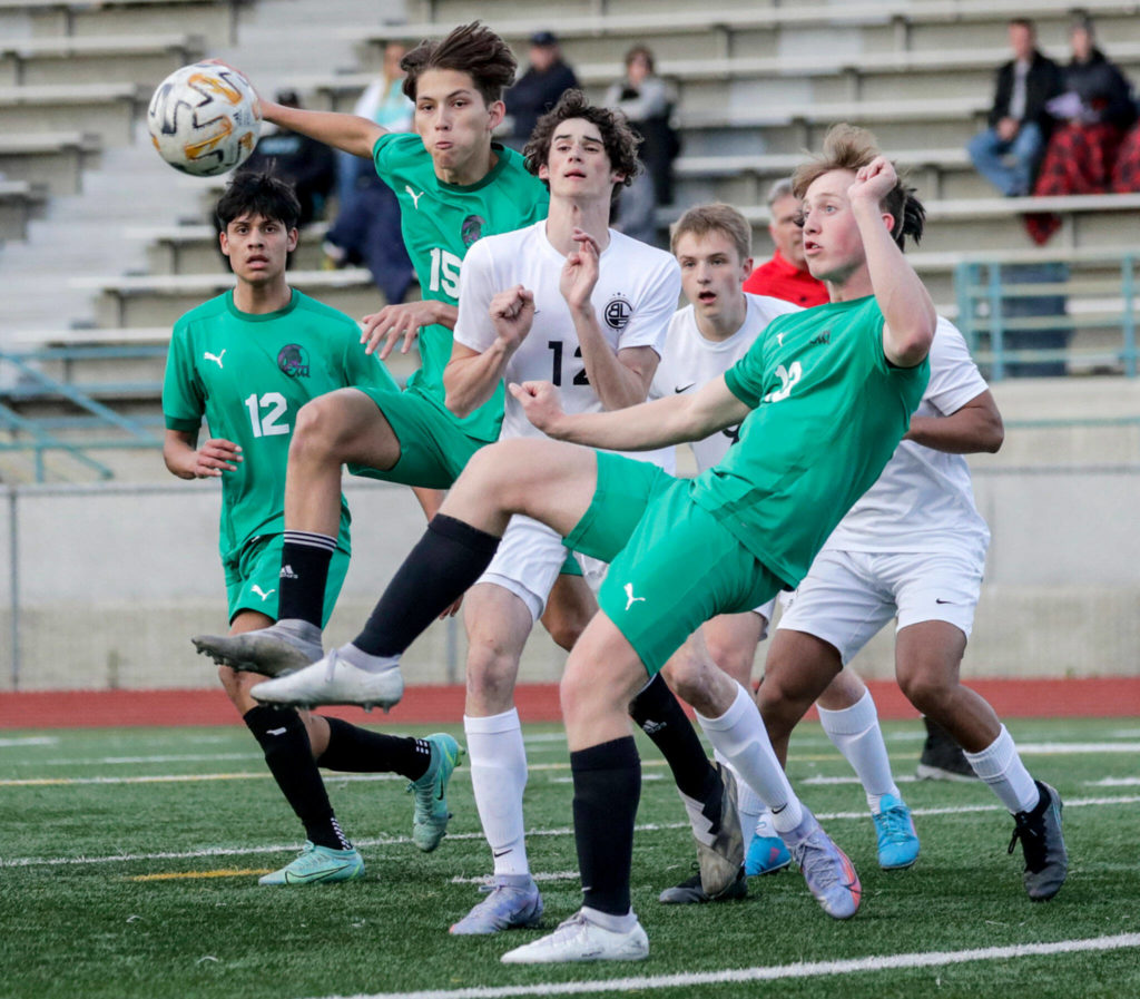 Edmonds-Woodway’s Phillip Borchert (right) looks to control the corner kick against Bonney Lake on Tuesday at Edmonds-Woodway High School. (Kevin Clark / The Herald)
