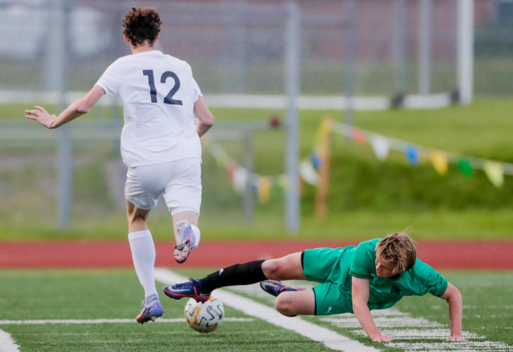 Edmonds-Woodway’s Kincaid Sund (right) attempts a tackle on Bonney Lake’s Cooper Wilson on Tuesday at Edmonds-Woodway High School. (Kevin Clark / The Herald)
