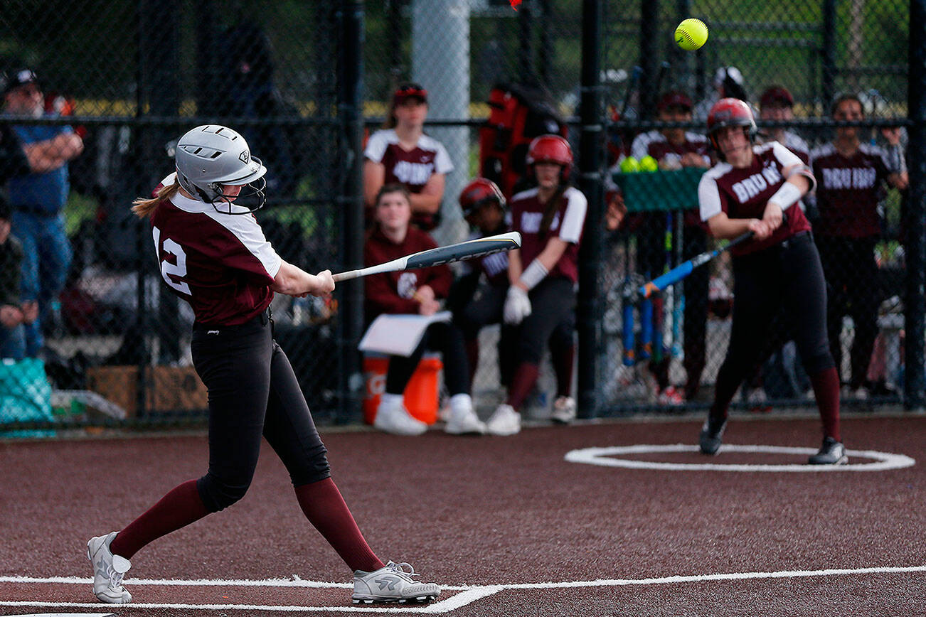 Cascade’s Abby Surowiec drives the ball against Arlington Tuesday, May 17, 2022, during a Class 3A District 1 matchup at the Phill Johnson Ballfields in Everett, Washington. (Ryan Berry / The Herald)